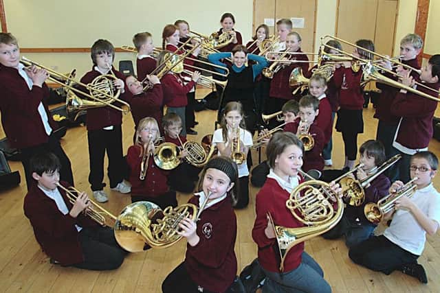 Emma Wilcox from Lincolnshire Music Services is pictured with Year Five and Six pupils from Hogsthorpe Primary School 10 years ago.