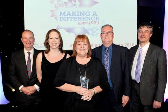 Carol Blades (centre) alongside Dr John Brewin - Chief Executive; Sarah Connery - Director of Finance and Information; Paul Devlin - Trust Chair; and Philip Jackson - Non-Executive Director.