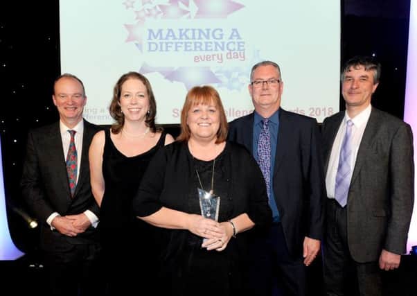 Carol Blades (centre) alongside Dr John Brewin - Chief Executive; Sarah Connery - Director of Finance and Information; Paul Devlin - Trust Chair; and Philip Jackson - Non-Executive Director.