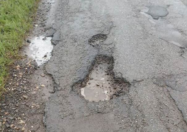 Potholes on Croft Low Road, Skegness. ANL-181202-132435001