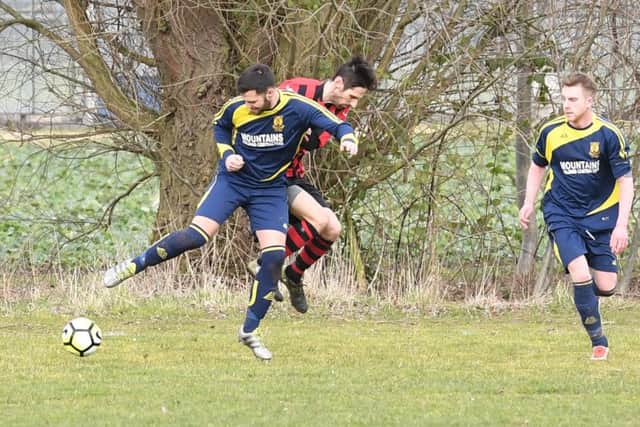 Park Utd (blue) v Woodhall (red). Dan Huskisson (blue), Sam Brader (red).