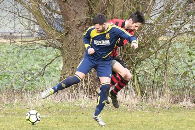 Park Utd (blue) v Woodhall (red). Dan Huskisson (blue), Sam Brader (red).