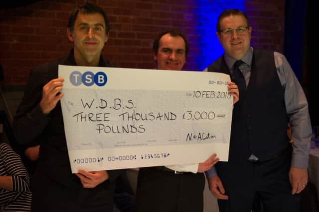 Ronnie O'Sullivan with World Disability Billiards and Snooker (WDBS) representatives Simon Berrisford and Matt Huart EMN-180219-155225002