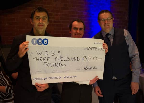 Ronnie O'Sullivan with World Disability Billiards and Snooker (WDBS) representatives Simon Berrisford and Matt Huart EMN-180219-155225002