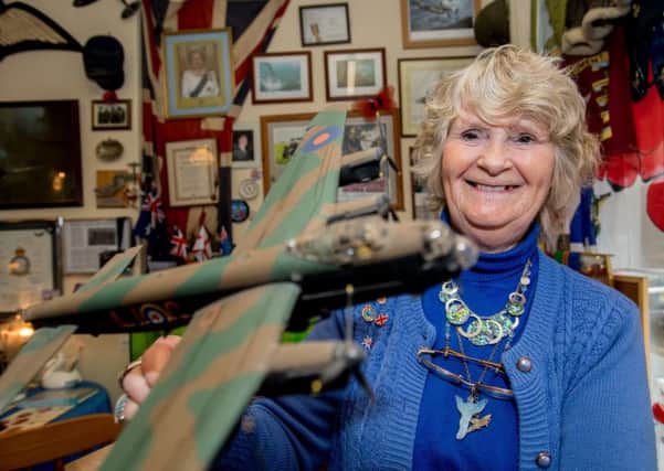 Janet Hunt with a model of a Lancaster bomber - just one item in her unique collection.  Picture: John Aron.