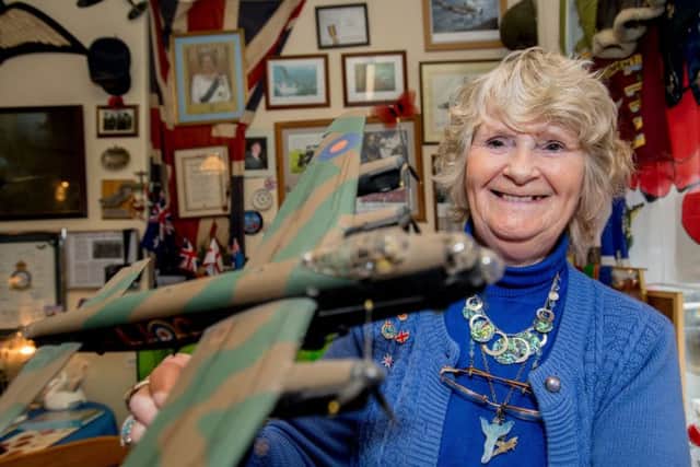 Janet Hunt with a model of a Lancaster bomber - just one item in her unique collection. Picture: John Aron.