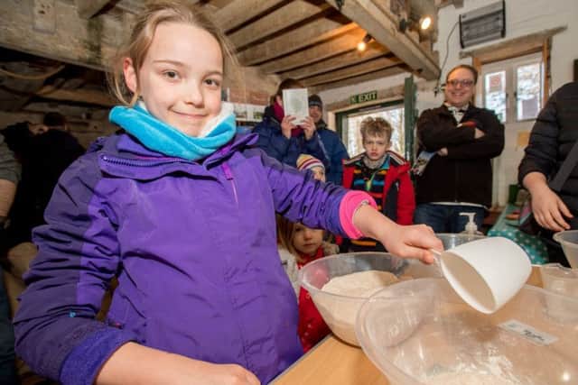 Isabelle Rogers age 9 has a go at making her own bread. EMN-180226-172600001