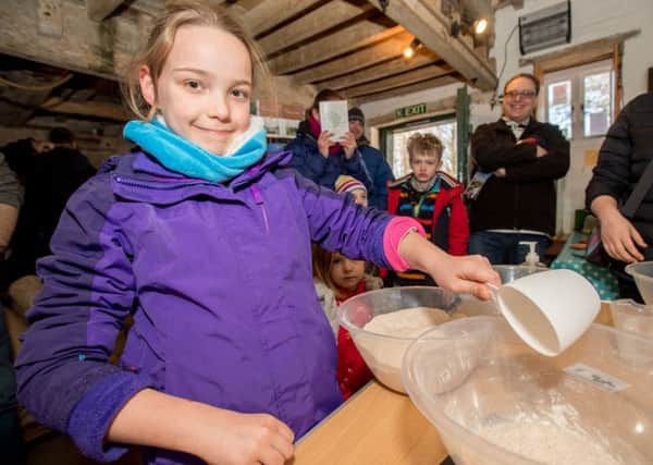 Isabelle Rogers age 9 has a go at making her own bread. EMN-180226-172600001