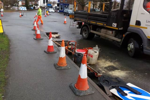 Damaged drain gulley being repaired on A158. Picture taken today (Wednesday) by John Fieldhouse. EMN-180221-133454001