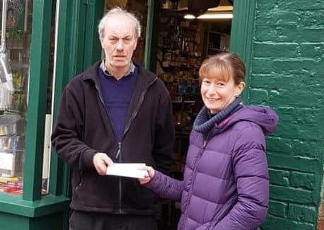Kathy O'Connor, from Horncastle Pet Centre, pictured with Geoff Boucher. EMN-180222-112208001