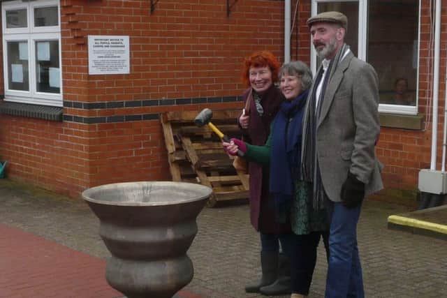 The first ring of the bell was undertaken by directors of the community arts group, Lincolnshire Time and Tide Bell Community Interest Company, Jean Vernon (with hammer), Jackie Scutt (left) and Mark Watkins.