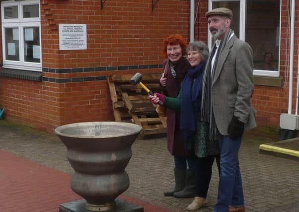 The first ring of the bell was undertaken by directors of the community arts group, Lincolnshire Time and Tide Bell Community Interest Company, Jean Vernon (with hammer), Jackie Scutt (left) and Mark Watkins.