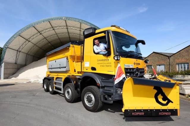 Coun Richard Davies pictured in one of the county's gritters, dubbed The Beast. EMN-180223-120141001