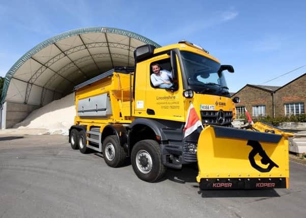 Coun Richard Davies pictured in one of the county's gritters, dubbed The Beast. EMN-180223-120141001