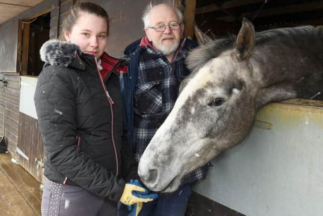 Dave Lawson and Jade Lawson, 17, with their horse Darcy who was victim of a hit and run at Ewerby. EMN-180227-002813001