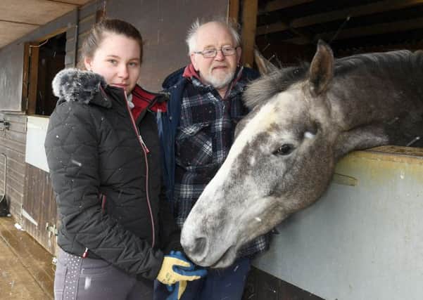 Dave Lawson and Jade Lawson, 17, with their horse Darcy who was victim of a hit and run at Ewerby. EMN-180227-002813001