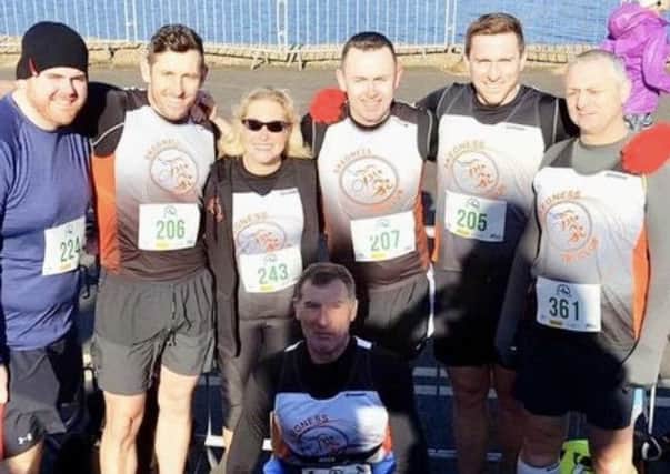 Pictured are Tri Club members Paul Harvey, Pete Nicholls, Hayley Smith, Lee St Quinton, Ash Epton, David Freeman and John Irving (front) at Nottingham.