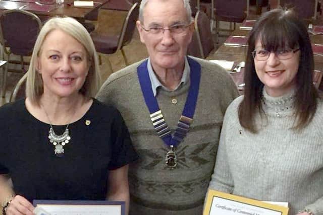 Lion Jo Coupland, left. Lion President Norman Barker and new Lion Jacqui Guthrie EMN-180503-110759001