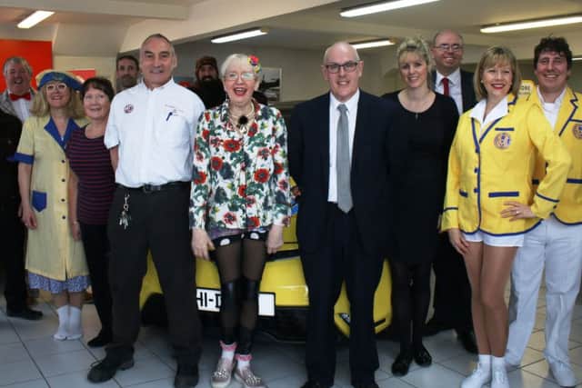 Su Pollard (centre), with cast members from Louth Riverhead Theatre and staff from car dealership NT Shaw of Louth who sponsor the theatre.