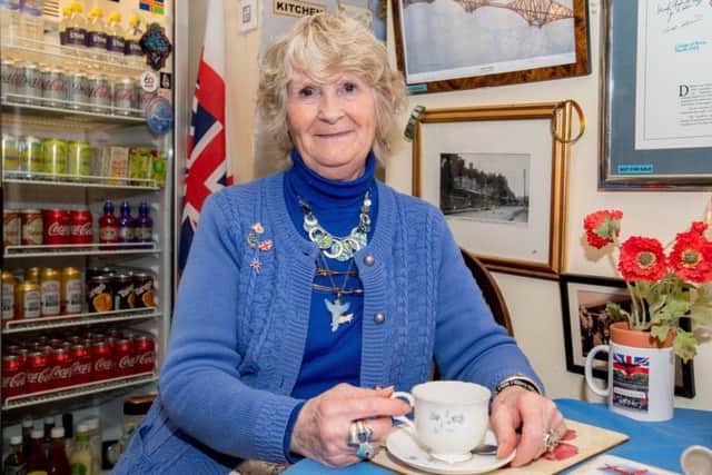 Cheers! Owner Janet Hunt in her tea room in Woodhall Spa...but will she swap the familiar surroundings for a special reunion in Canada? Picture: John Aron.