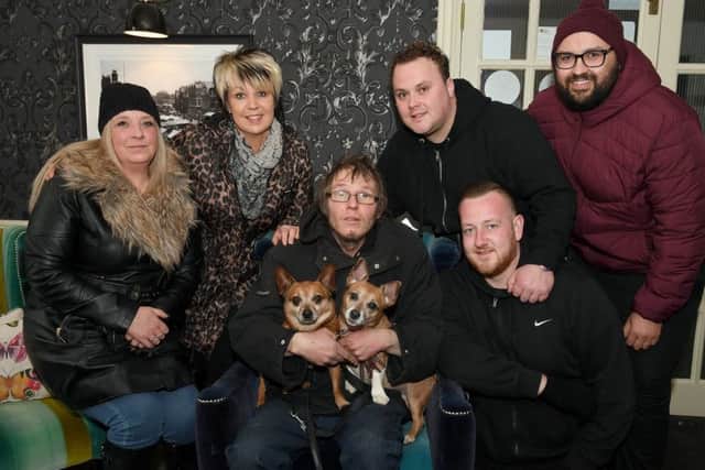 Jeremy Smith with his dogs Bailey and Cassie and some of the people who helped him find shelter (from left) Patsie Marson, Karen Crozier, Jed Haw, Billy Maddison, and Mario Richards.