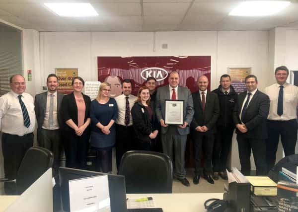 Drayton Motors collected the Customer Experience Award at Kias annual National Dealer Conference in January. Kia sales director Steve Hicks is second from the right.