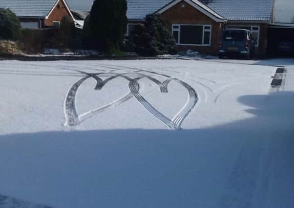 Gill Dwyer awaoke in Leasingham to find this romantic coincidence when neighbours maneouvred outside this morning (Thursday). EMN-180103-152802001
