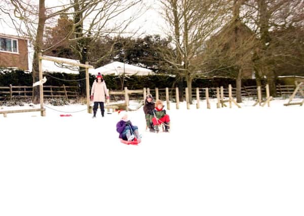 Sledging at Caistor's South Street Park EMN-180203-090810001
