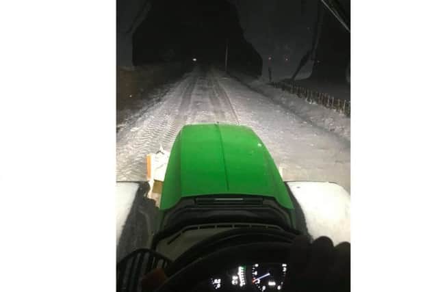 The tractor came into its own when farmers Simon and James Burton of Leasingham pulled cars and lorries out of drifts last night. EMN-180203-114958001