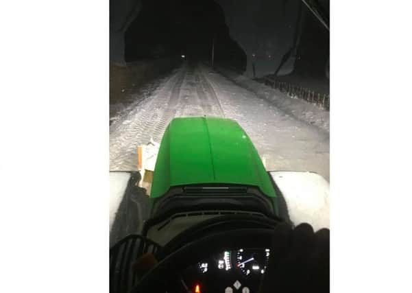 The tractor came into its own when farmers Simon and James Burton of Leasingham pulled cars and lorries out of drifts last night. EMN-180203-114958001