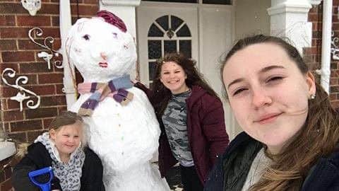 At least the snowman is looking cool in his scarf. This picture of Emmie, Olivia and Georgia having fun was taken by Alex Ward. ANL-180103-130047001