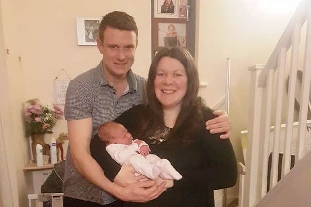Proud parents Sarah and Jamie with baby Perrie.