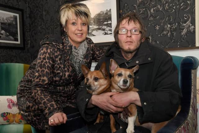 Jeremy Smith gets shelter at The White Hart Hotel with Karen Crozier.