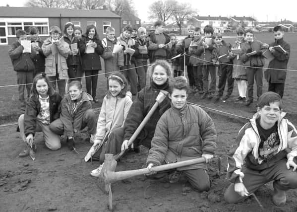 Youngsters are pictured at Staniland School in March 1993, helping excavate the site of a planned environmental nature area.