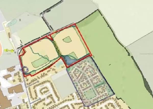 The area marked out in red is the site for the new homes.