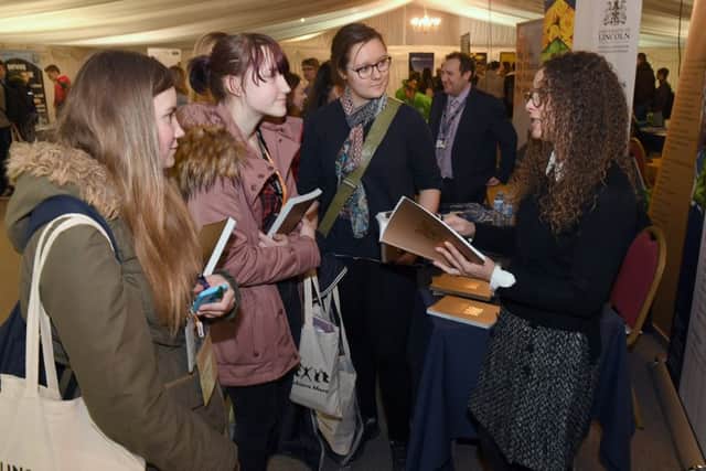 Careers' Day at Springfields Events and Conference Centre. Boston College students L-R Hope Starsmore 17, Kamile Petkute 16 and Emily Kratsch 16 talking to Maria Morgan - University of Lincoln marketing and comunications officer. EMN-180903-112453001