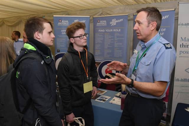 Careers' Day at Springfields Events and Conference Centre. Boston College students L-R Kane Partridge 17 and Thomas Haywood 17 talking to Sargeant John Gill. EMN-180903-112527001