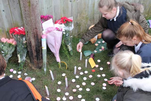 Flowers, candles, and heartfelt messages were left in memory of Amelia Wood.