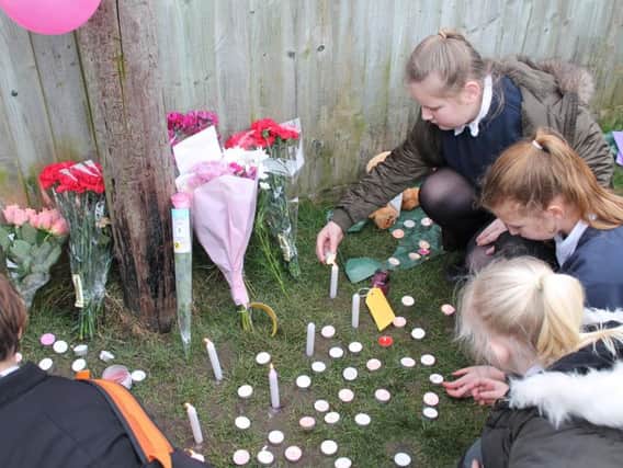Flowers, candles, and heartfelt messages were left in memory of Amelia Wood.