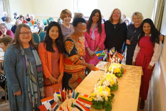 Members of HIWC lit a candle for each country represented - that's 32 in all. EMN-181203-064045001