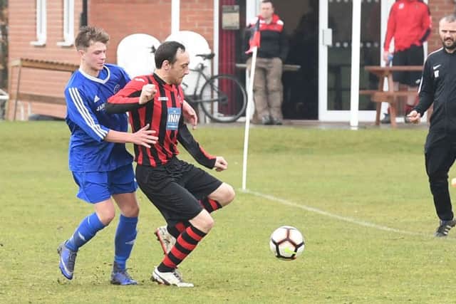 Woodhall Spa Reserves (red) v Swineshead Institute A (blue). Jay Peterson (red), Bailey Allgood (blue).