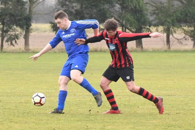 Woodhall Spa Reserves (red) v Swineshead Institute A (blue). Jackson Draper (red), Kieran Gatenby (blue).