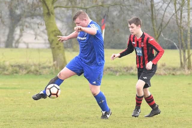 Woodhall Spa Reserves (red) v Swineshead Institute A (blue). Oliver Riley (red), Dan Lumley (blue).
