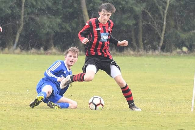 Woodhall Spa Reserves (red) v Swineshead Institute A (blue). Alfie Lindsey (red), Harry Lynch (blue).