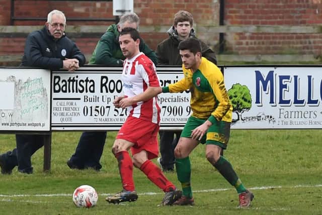 Horncastle (red) v Skegness (yellow). Liam Papworth (red), Courtney Warren (yellow).
