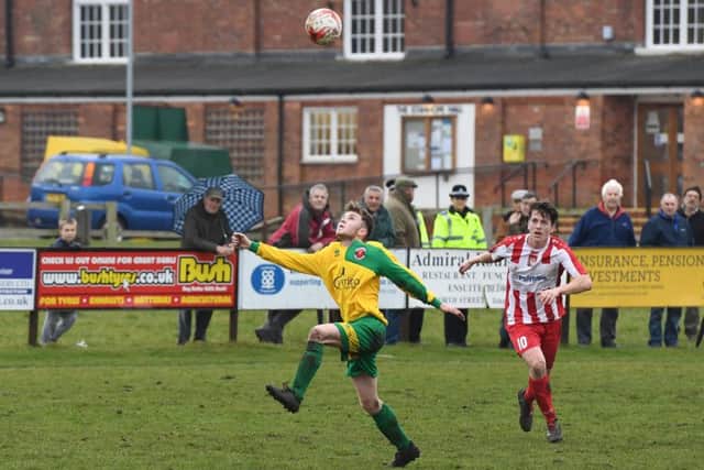 Horncastle (red) v Skegness (yellow). Andrew Bullivant (red), Jordon Potts (yellow).