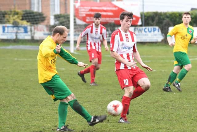 Horncastle (red) v Skegness (yellow). Andrew Bullivant (red), Aaron Scutt (yellow).