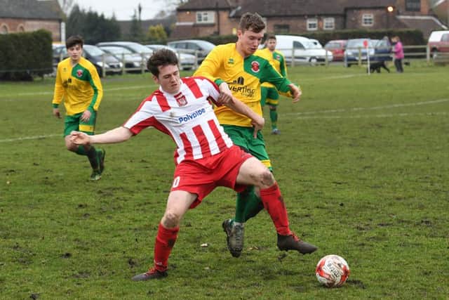 Horncastle (red) v Skegness (yellow). Andrew Bullivant (red), Jordon Smith (yellow).