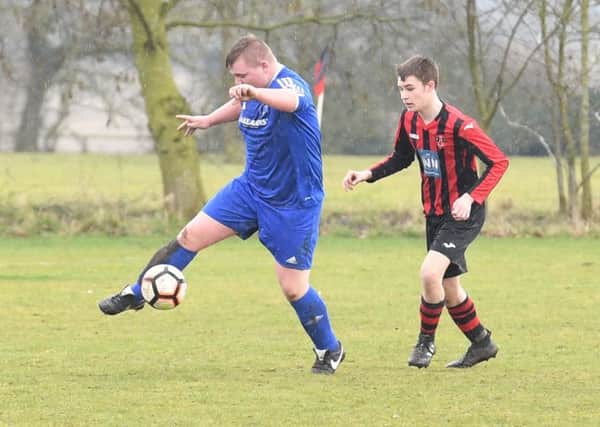 Woodhall Spa Reserves (red) v Swineshead Institute A (blue). Oliver Riley (red), Dan Lumley (blue).