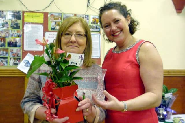Linda Todd received her award from speaker Carolyn Lingard-Vickers EMN-180314-121421001